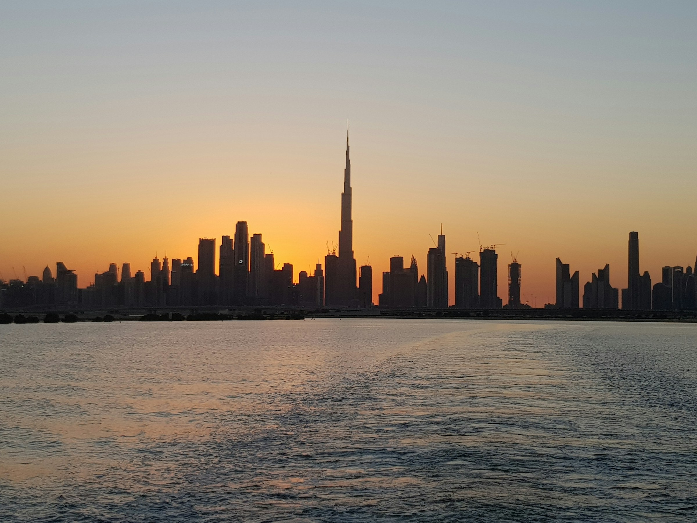 Dubai skyline and Burj Khalifa at sunset